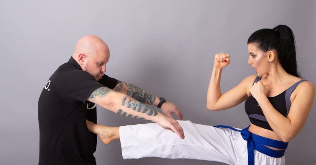 Student executing defensive movement with instructor guidance during self defense fundamentals training